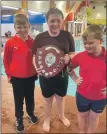  ?? Photograph: Oban Lifesaving Club. ?? Kyle Mackie with the Kayla MacDonald Cup which was presented to him by Kayla’s brothers, Ruardigh and Ronnie MacDonald.