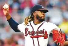  ?? AP PHOTO/JOHN BAZEMORE ?? Atlanta Braves starting pitcher Touki Toussaint throws against the San Diego Padres in the second inning of Tuesday’s game in Atlanta.