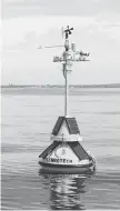  ?? ED VERHAMME ?? A weather-informatio­n-collection buoy is shown off the shore of Cleveland in Lake Erie. A simple text message to the buoy will provide weather data.