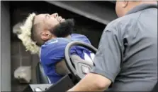  ?? BILL KOSTROUN — THE ASSOCIATED PRESS ?? New York Giants wide receiver Odell Beckham reacts while being carted off the field after an injury during the second half of an NFL football game against the Los Angeles Chargers, Sunday in East Rutherford, N.J. The Chargers won 27-22.