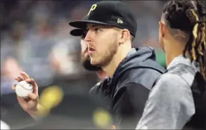  ?? Gene J. Puskar / Associated Press ?? Pirates starting pitcher Jameson Taillon sits in the dugout during an August 2019 game against the Mets.