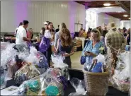  ?? BARRY TAGLIEBER — FOR MEDIANEWS GROUP ?? In addition to food, Bite for the Fight guests could also bid on a variety of gift baskets.