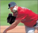  ?? NANCY LANE/ BOSTON HERALD FILE ?? Red Sox pitcher Brian Johnson throws during summer camp on Tuesday.