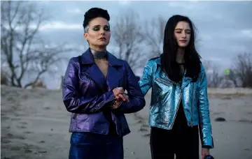  ?? — Courtesy of Neon ?? Portman, left, stars in ‘Vox Lux’ with Cassidy, who plays two roles.