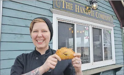  ?? DANIEL BROWN/JOURNAL PIONEER ?? Sarah Bennetto O’Brien holds a handpie outside of her shop, the Handpie Company in Gateway Village, Borden-Carleton. The shop used to be called Scapes, but has been rebranded to focus on handpie production.