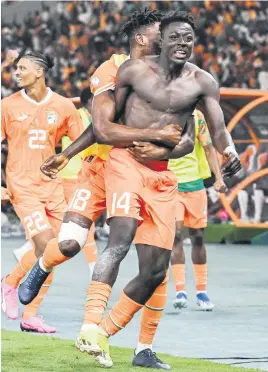  ?? Picture: AFP ?? STAYING ALIVE. Ivory Coast’s Oumar Diakite (centre) celebrates with team-mates after scoring the winning goal in their Africa Cup of Nations quarterfin­al against Mali in Bouake on Saturday.