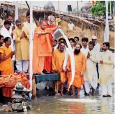  ?? — PTI ?? UP CM Yogi Adityanath performs puja at the Saryu river in Ayodhya on Wednesday.