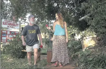  ?? PICTURES: LEON LESTRADE ?? GUERILLAS IN THE MIDST: Permacultu­rists Frank Edwards and Vanessa Meintjes after ‘foraging’ for edible weeds in a garden where there is sometimes too much food for monkeys to eat.