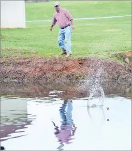  ?? FILE PHOTO ?? John Baker skips a rock across the pond at MacArthur Park in downtown Little Rock. He created a nonprofit organizati­on, Great Southern Stone-Skipping Championsh­ips Inc. The secondannu­al event will be Saturday in a cove near the Fairfield Bay Marina on...