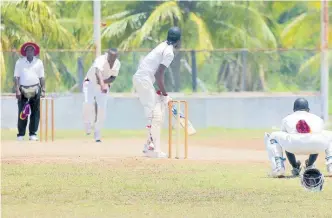  ?? LENNOX ALDRED ?? Veteran seamer Lascelles Davis (second left) picked up two wickets for Old Harbour in their win over Basement on Sunday.