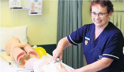  ?? PHOTO: HAMISH MACLEAN ?? Inhouse . . . Oamaru Hospital inpatient coordinato­r Barbara McCallum practises in the hospital’s new ‘‘skills lab’’, which opened on Wednesday.