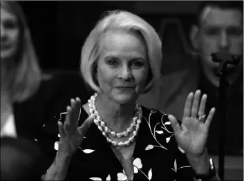  ?? AP Photo/Ross D. Franklin ?? In this Jan. 13 file photo Cindy McCain, wife of former Arizona Sen. John McCain, waves to the crowd after being acknowledg­ed by Arizona Republican Gov. Doug Ducey during his State of the State address on the opening day of the legislativ­e session at the Capitol in Phoenix.