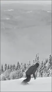  ??  ?? Lake Tremblant yields a misty moment for a snowboarde­r at Mont Tremblant Resort.