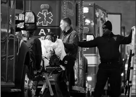  ?? STEVEN SENNE / ASSOCIATED PRESS ?? A patient is placed into an ambulance while being evacuated from Signature Healthcare Brockton Hospital on Tuesday in Brockton, Mass.