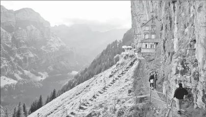  ?? CAMERON HEWITT | RICK STEVES’ EUROPE ?? HIGH ABOVE the town of Appenzell, Switzerlan­d’s Ebenalp summit is home to a family-run hut with cheap dorm beds and a fantastic view.