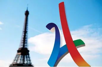  ?? — AFP file photo ?? The logo of the Paris 2024 Olympic campaign next to the Eiffel Tower, as the Internatio­nal Olympic Committee visits Paris for an inspection of the city’s 2024 Games bid.