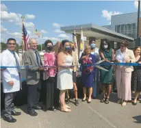  ?? MICHELLE MULLINS/DAILY SOUTHTOWN ?? Will County Health Department Executive Director Susan Olenak cuts the ribbon Sept. 10, 2021, officially opening the department’s new facility.