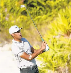  ?? ROB CARR/GETTY IMAGES ?? Tony Finau putts on the 16th green during Round 3 of the Hero World Challenge. He shares the lead with Jon Rahm and Henrik Stenson.