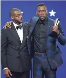  ?? CHRIS PIZZELLO/INVISION/AP ?? Mahershala Ali, right, brings Kris Bowers, composer for “Green Book,” on stage.