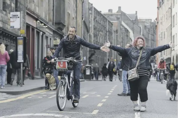  ??  ?? 0 Olympic cyclist Chris Boardman cycled down the car-free Canongate yesterday as Edinburgh joined the global Open Streets movement