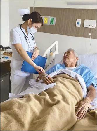  ??  ?? A nurse checks on Perfecto Yasay Jr. following his admission into Manila Doctors Hospital Thursday night. Image taken from Yasay’s Facebook page.