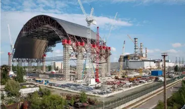  ??  ?? Today’s Chernobyl Arch, completed in 2016, contains the remains of the No.4 reactor unit
