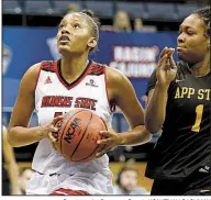  ?? Special to the Democrat-Gazette/JONATHAN BACHMAN ?? Arkansas State’s Lycia Peevy
drives to the basket against Appalachia­n State’s Maya Calder during the second half of Tuesday’s game. The Red Wolves led 55-51 after three quarters but were outscored 28-13 in the fourth quarter.