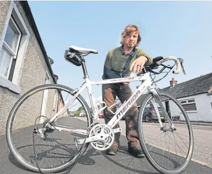  ?? Picture: Gareth Jennings. ?? Patrick Duncan of Luthermuir with his damaged bike after he was hit by a car while out training.