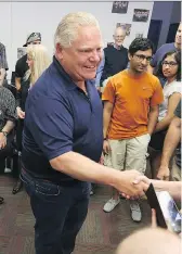  ?? MEGHAN BALOGH ?? Left: Doug Ford greeted supporters during a whistle stop in Kingston on Sunday. Right: Ontario NDP Leader Andrea Horwath greets senior citizen homeowners at a campaign event in Mississaug­a on Saturday.