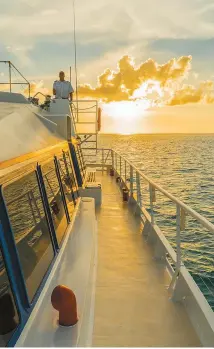  ?? Courtesy of Marianas Visitors Authority ?? Tourists can watch a romantic Saipan sunset on a sunset cruise.