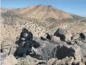  ??  ?? FATHER MOUSA prays outside St. Antony Coptic Orthodox Monastery in Newberry Springs.