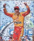  ?? Brynn Anderson / ?? Joey Logano celebrates in Victory Lane after winning Sunday’s race at Talladega Superspeed­way. TALLADEGA, Ala.