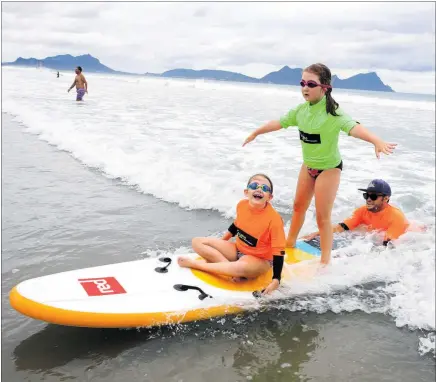  ?? PHOTO / MICHAEL CUNNINGHAM ?? After having to cancel its disabled surfing day at Ruakākā last year — this pic is from 2020 — along with several other events due to Covid-19, the Tiaho Trust hopes the weather won’t conspire to wipe out its next Catch a Wave event at the beach on February 11.