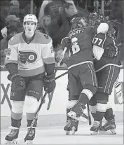  ?? Derik Hamilton Associated Press ?? KINGS CENTER Jeff Carter (77) celebrates with Drew Doughty after scoring in overtime, and Philadelph­ia’s Dale Wise skates off the ice.