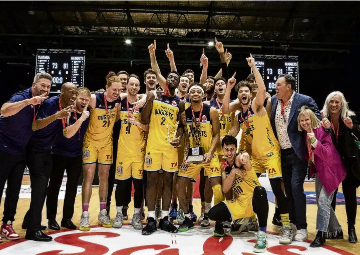  ?? PHOTO: RENDER CREATIVE ?? Triumphant . . . The Otago Nuggets celebrate victory in the National Basketball League final in Auckland on Saturday night.