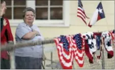  ?? ERIC GAY — THE ASSOCIATED PRESS ?? Donna King stands for the national anthem during a Veterans Day event, Saturday in Sutherland Springs, Texas. The event was held in the community, just a block away from the Sutherland Springs First Baptist Church where a man opened killing more than...