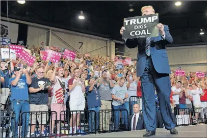  ?? [SUSAN WALSH/THE ASSOCIATED PRESS PHOTOS] ?? President Donald Trump shows his support for coal miners as he arrives Thursday to speak at a campaign-style rally at Big Sandy Superstore Arena in Huntington, W.Va.