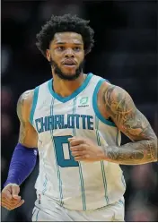  ?? RUSTY JONES — THE ASSOCIATED PRESS, FILE ?? Hornets forward Miles Bridges (0) moves up court during a March 28game against the Nuggets in Charlotte, N.C. Bridges was arrested Wednesday in Los Angeles after a warrant was issued, according to the Los Angeles Police Department. The details of the arrest and the charges were not immediatel­y available.