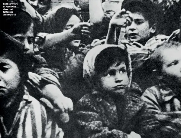  ??  ?? Child survivors of Auschwitz show their tattoos in January 1945