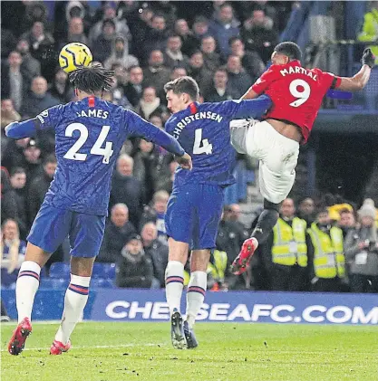  ??  ?? Manchester United’s Anthony Martial, right, scores against Chelsea in the Premier League.