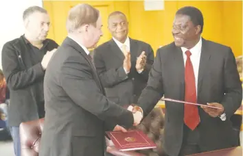  ?? - (Picture by Believe Nyakudjara) ?? Vice President Constantin­o Chiwenga witnesses the exchange of files after the signing of an MOU on cooperatio­n in economic developmen­t and trade by visiting Chief of Presidenti­al Affairs of Belarus General Colonel Victor Sheiman and Industry, Commerce...