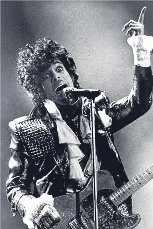  ??  ?? Prince performs at Riverfront Coliseum in Cincinnati, Ohio, during his Purple Rain Tour in 1985.