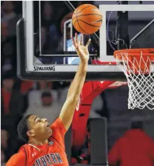  ?? THE ASSOCIATED PRESS ?? Auburn’s Chuma Okeke scores in the second half during a 78-61 victory over Georgia on Saturday in Athens, Ga.