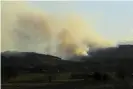  ??  ?? Smoke from an out-of-control bushfire atKingiman near Ulladulla on the south coast.Photograph: Lukas Coch/AAP