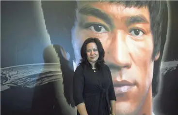  ?? ANTHONY WALLACE/AFP/ GETTY IMAGES ?? Shannon Lee, daughter of martial arts icon and film actor Bruce Lee, poses during an interview with AFP in Hong Kong on July 18, 2013.