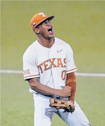  ?? ERIC GAY/AP ?? Shortstop Trey Faltine celebrates during Texas’ super regional victory over South Florida on Sunday.