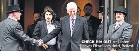  ??  ?? CHECK HIM OUT Mr Clinton leaves Fitzwillia­m Hotel, Belfast