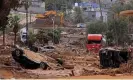  ?? Photograph: Karim Sahib/AFP/Getty Images ?? Damaged vehicles lie in mud in Derna.