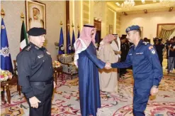  ??  ?? Deputy Prime Minister and Interior Minister Sheikh Mohammed Al-Khaled Al-Hamad Al-Sabah greets an officer.—Interior Ministry photos