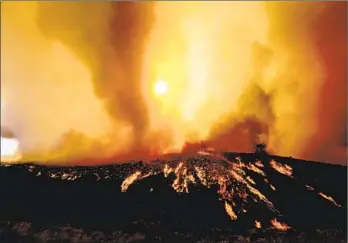  ?? Photograph­s by Luis Sinco Los Angeles Times ?? A SMOKE TORNADO and flames swirl in the Fairview fire Tuesday along Batista Road near Hemet. Two people who died appeared to be fleeing before being overcome, officials said. A third was injured.